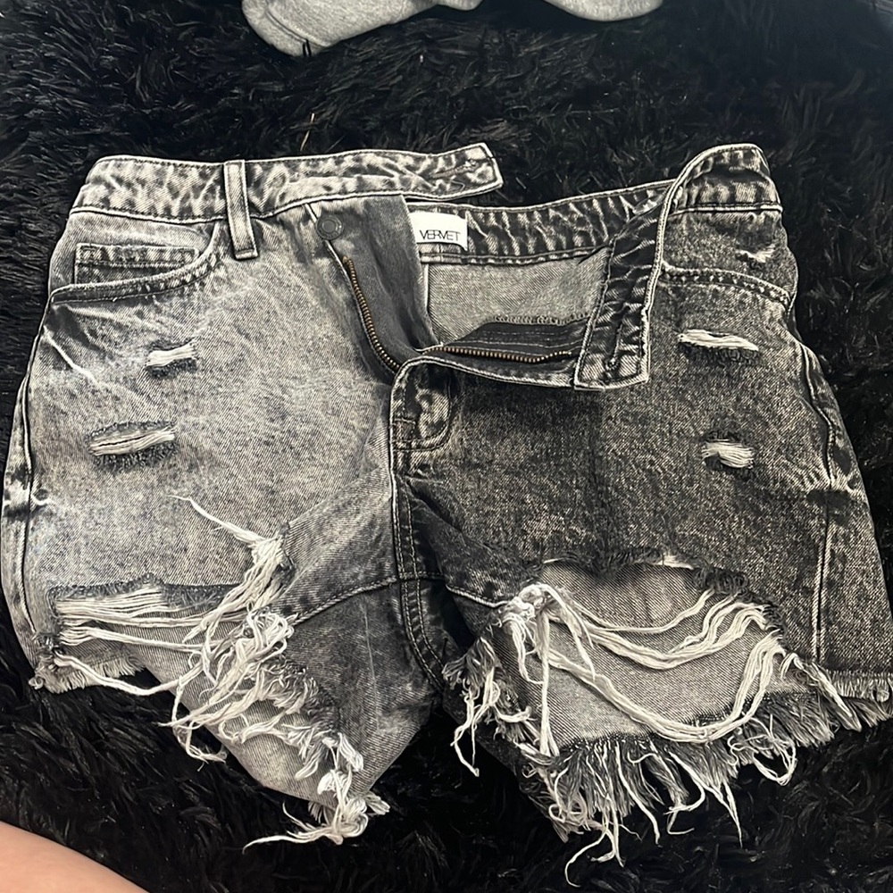 Cute black jean shorts. 2 tone, crossover shorts. Never worn. New with no tags